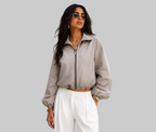 CHAQUETA CORTAVIENTOS DE CREMALLERA Y CUELLO ALTO
